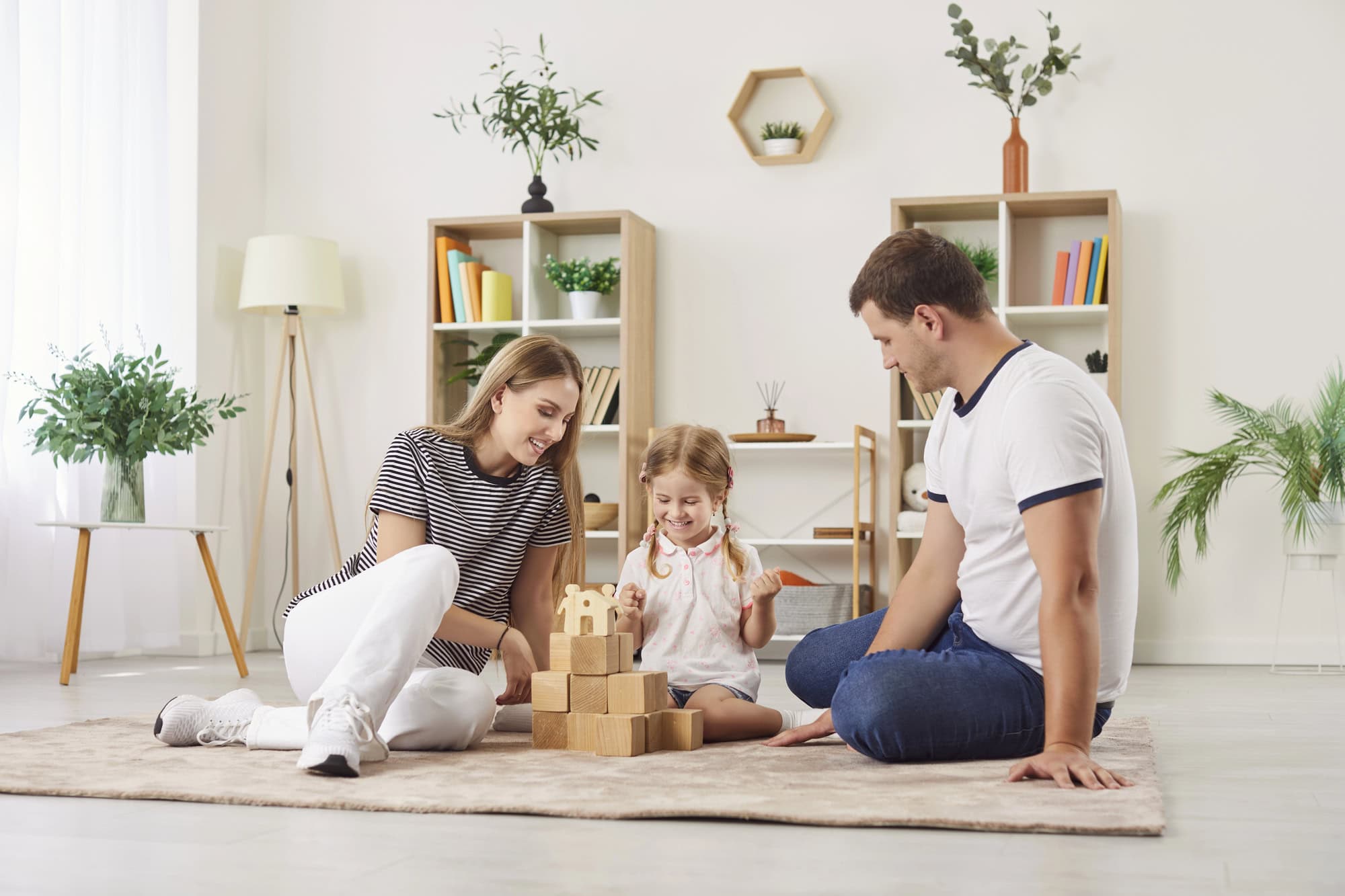 Family playing with wooden blocks